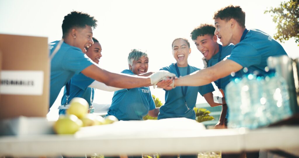 Team building, volunteer and charity as group for community service, project or nonprofit initiativ